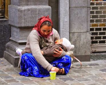 Why is the child in hands of the beggar always sleeping?
